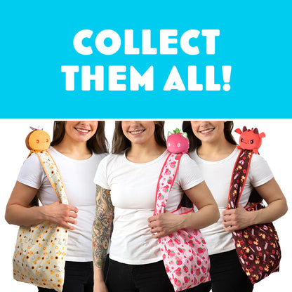 Three women holding TeeTurtle Veggie Bunny Plushie Tote Bags with the text collect them all.