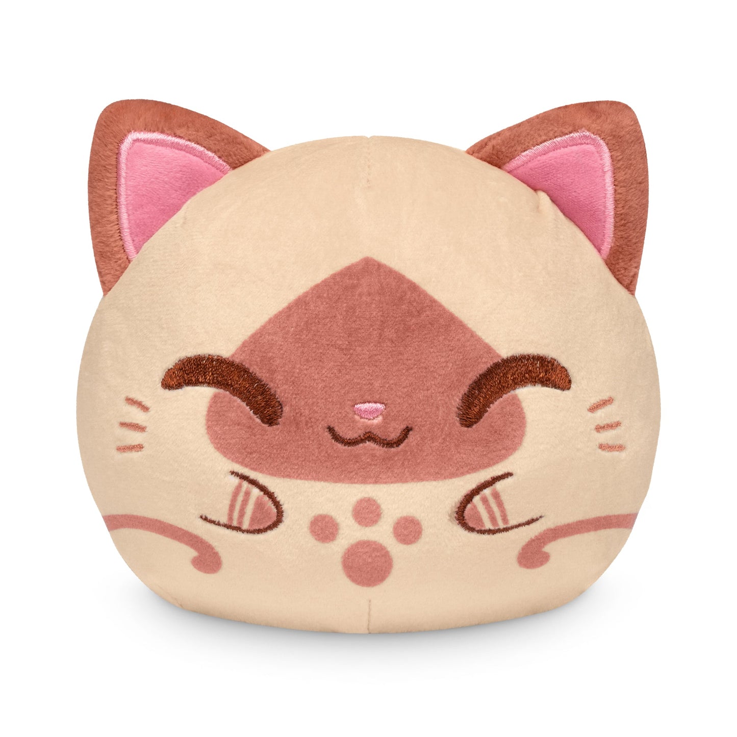 A round, plush toy resembling a stylized cat face with closed eyes, pink ears, and a smiling expression. This stuffed toy features a combination of light beige and pink colors. The product is the Plushiverse Palico 4" Reversible Plushie by Monster Hunter.