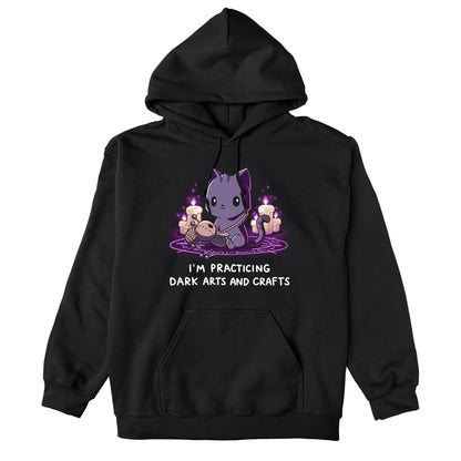 Pullover Hoodie_TeeTurtle Dark Arts and Crafts black t-shirt featuring a cat crafting a voodoo doll