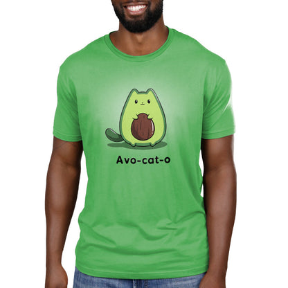 Premium Cotton T-shirt_TeeTurtle Avo-cat-o apple green t-shirt featuring an avocado-shaped green cat holding a brown avocado pit, with the text "Avo-cat-o" written below in this fun animal design.