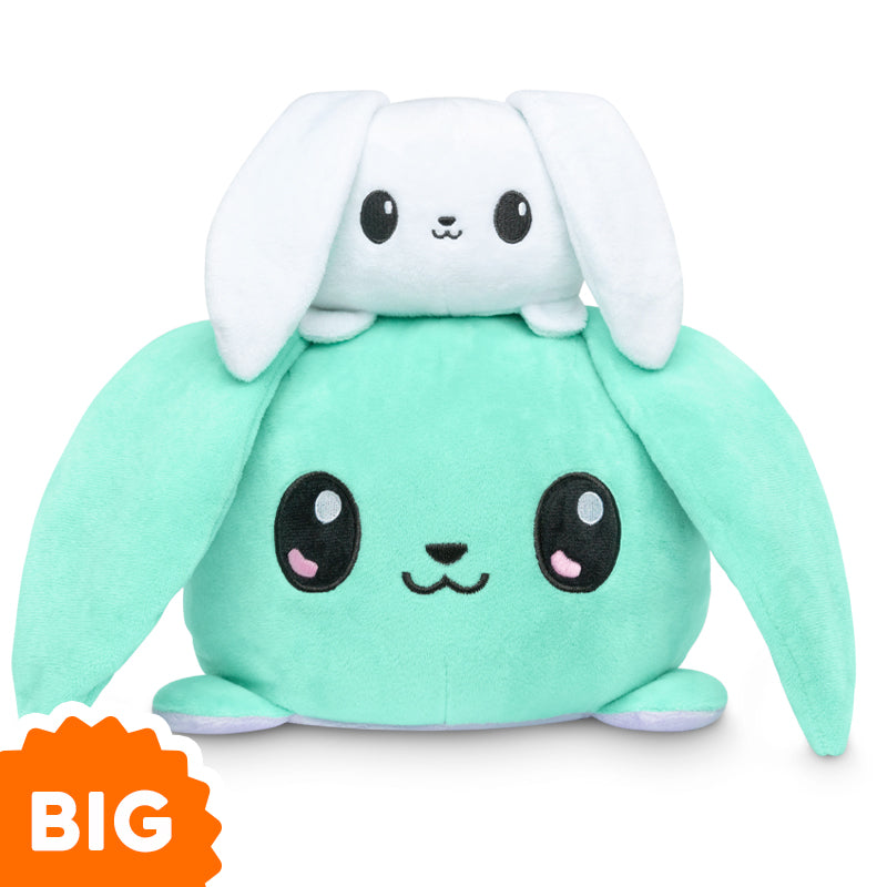 A Big Reversible Bunny Plushie from TeeTurtle with a green and white bunny sitting on top of each other.