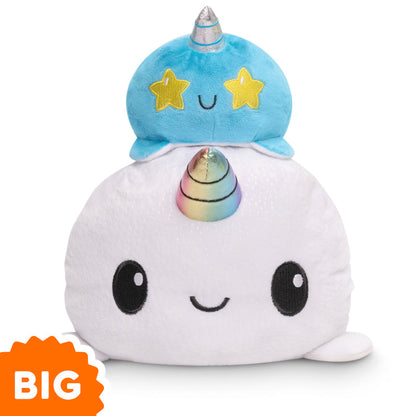 A TeeTurtle Big Reversible Narwhal Plushie with a star on top of it.