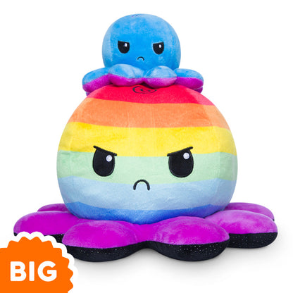 A Big Reversible Octopus Plushie from TeeTurtle sits on top of a tall octopus plushie.