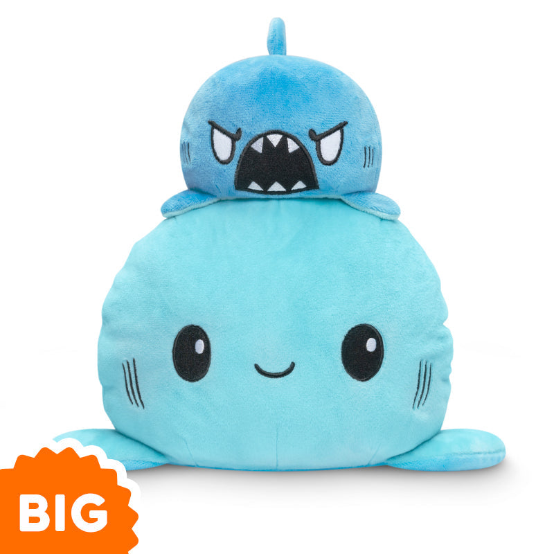 A Big Reversible Shark Plushie by TeeTurtle is stacked on top of another.