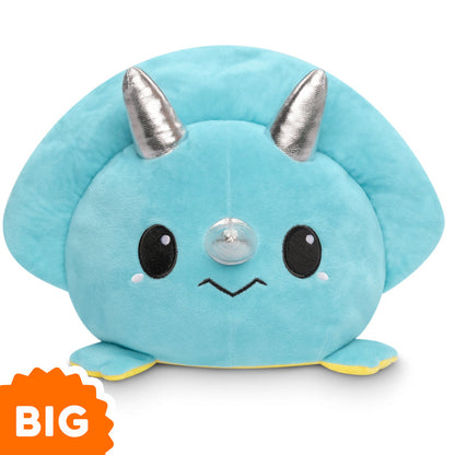 A Big Reversible Stego & Triceratops Plushie by TeeTurtle, a blue plush dinosaur with silver horns that can express emotions as a mood plushie.