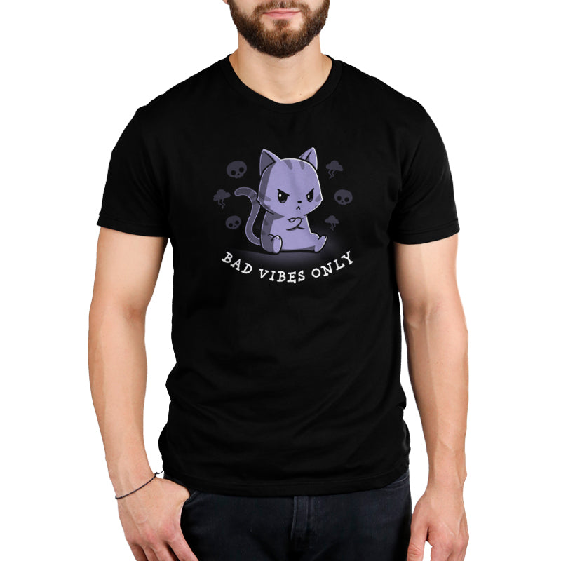 Premium Cotton T-shirt_Teeturtle Bad Vibes Only black t-shirt featuring an angry grumpy looking cat with its forepaws crossed and surrounded by skulls and lightning clouds with 'Bad Vibes Only' written underneath it.