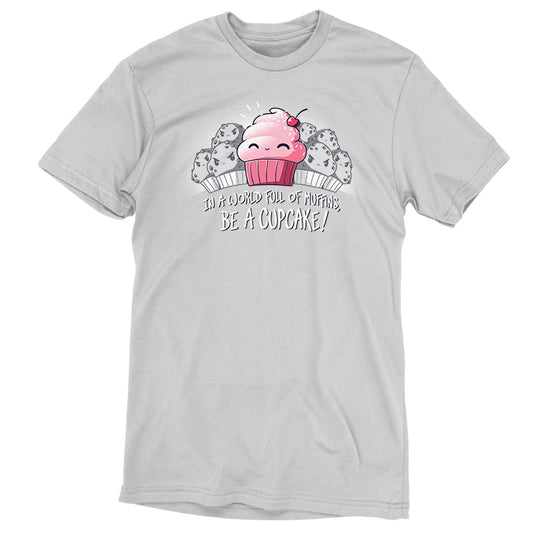 Premium Cotton T-shirt_TeeTurtle Be a Cupcake silver gray t-shirt featuring a cheerful pink cartoon cupcake with a cherry on top smiling among angry muffins, captioned 