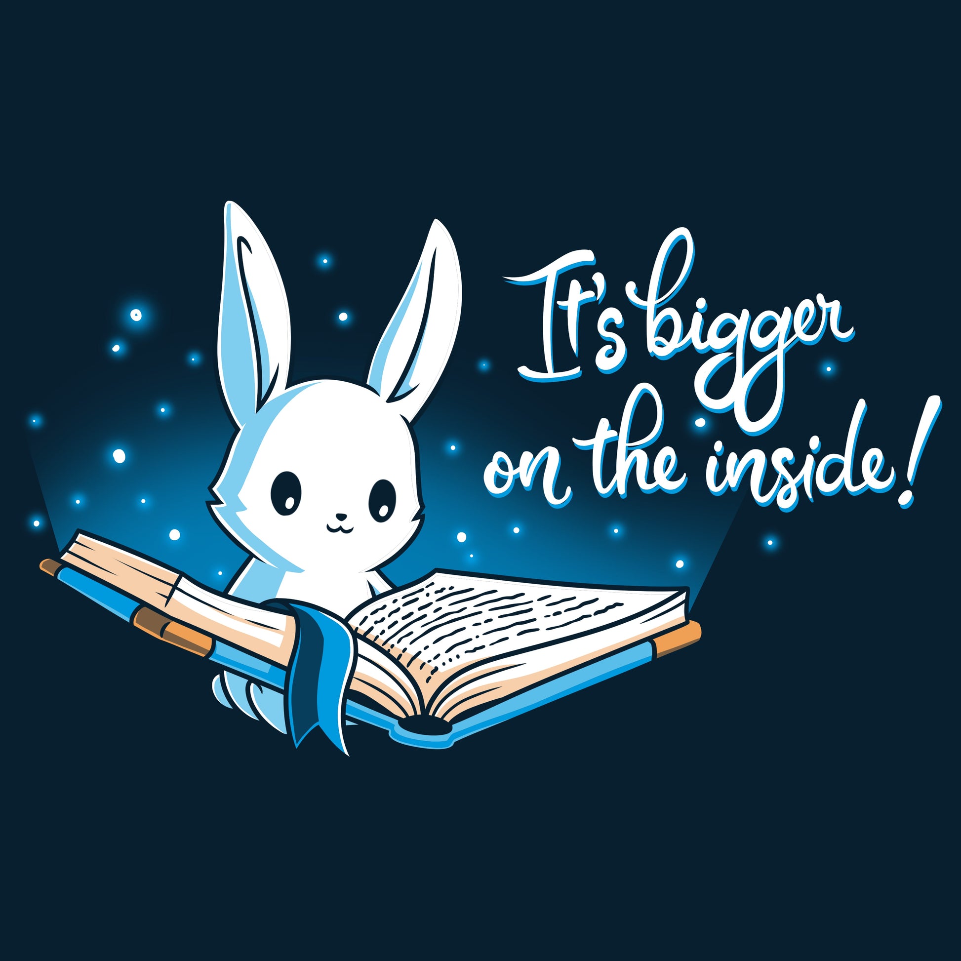 Premium Cotton T-shirt_Teeturtle Books are Bigger on the Inside Navy Blue t-shirt featuring a white rabbit reading a book from which light and sparkles are coming out with a blue ribbon bookmark marking the page with the text "It's bigger on the inside!" written next to it.