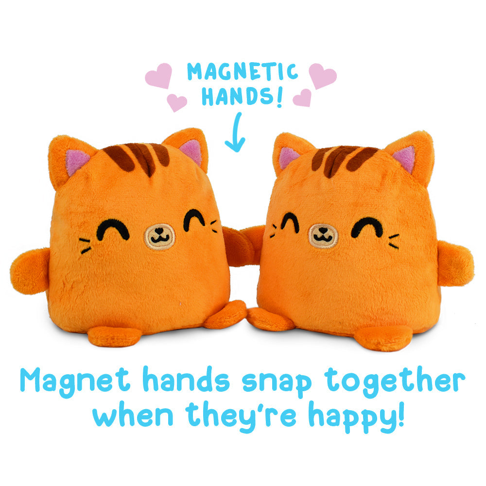 Two TeeTurtle Reversible Cat Plushmates with magnetic hands that snap together when they're happy.