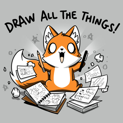 Premium Cotton T-shirt_A cartoon fox enthusiastically holding drawing tools, surrounded by sketchbooks with various drawings. Text above reads "Draw All The Things!" This monsterdigital original Draw all the Things! is crafted from super soft ringspun cotton for ultimate comfort.