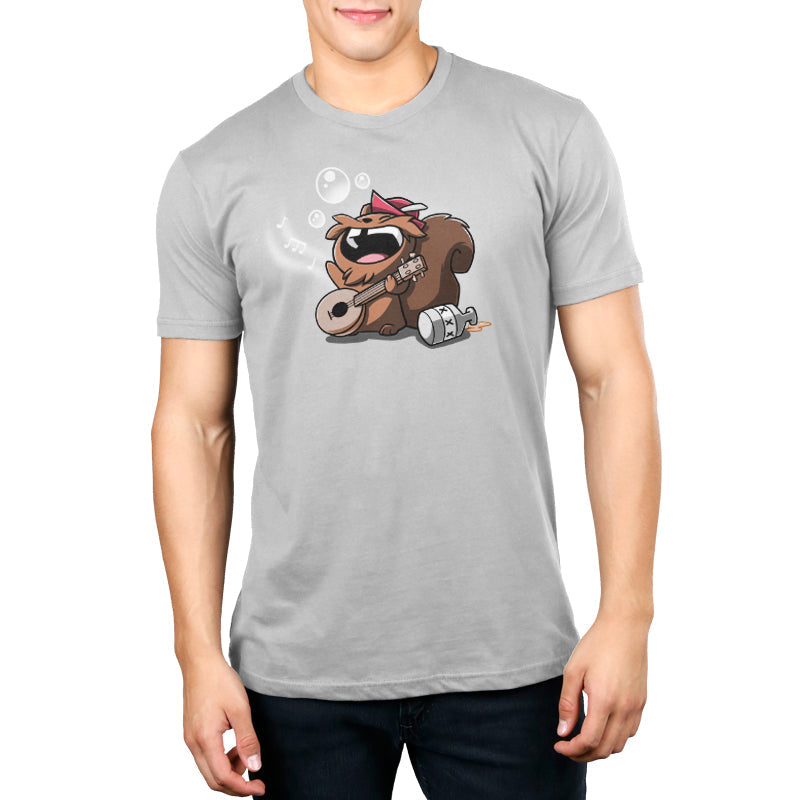 Premium Cotton T-shirt_Teeturtle Drunken Bard silver gray t-shirt featuring a squirrel wearing a red cap joyfully playing a banjo while singing. Musical notes and bubbles float around, and a moonshine jug is placed next to the squirrel.