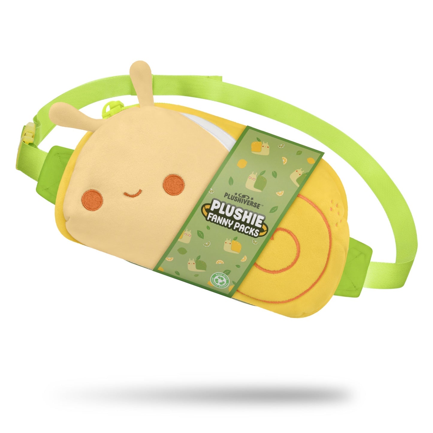 A yellow and green, snail-shaped fanny pack with a smiling face, part of the Sweet & Sour collection. It boasts hands-free functionality and is labeled "Plushiverse Swirly Snail Plushie Fanny Pack" by TeeTurtle on a green tag.