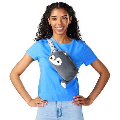 Woman smiling with a Plushiverse Lone Wolf Plushie Fanny Pack by TeeTurtle over her shoulder, featuring an adjustable belt.