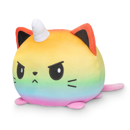 A cuddly Giant Moody Kittencorn Plushie by TeeTurtle with a unicorn horn on its head surrounded by a variety of animals.