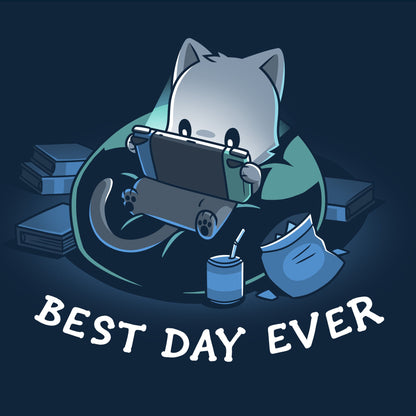 Classic Cotton T-shirt_TeeTurtle Best Day Ever navy blue t-shirt featuring an illustration of a cat sitting on a bean bag chair playing a portal video game surrounded by a mess of books and an open bag of chips and a can of soda with a straw. "BEST DAY EVER" is written underneath.