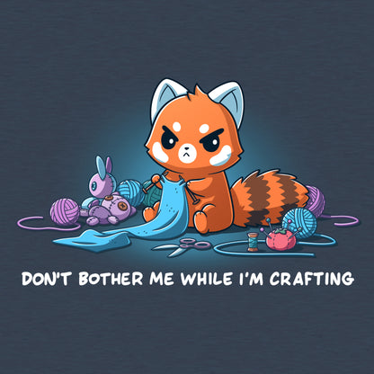 Classic Cotton T-shirt_TeeTurtle heather navy Don't Bother Me While I'm Crafting featuring an introverted, knitting red panda surrounded by knitting materials.