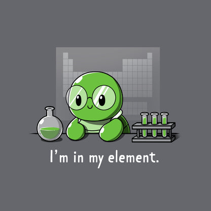 Classic Cotton T-shirt_A cartoon green turtle wearing glasses is in a lab with beakers and test tubes filled with green liquid. Text below reads, "I'm in my element." Wear this scene on an "I'm in My Element" apparel made from charcoal gray Super Soft Ringspun Cotton by monsterdigital.