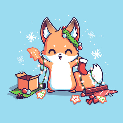 Classic Cotton T-shirt_TeeTurtle It's That Time of Year light blue t-shirt featuring a cheerful fox with green garland around its left ear surrounded by snowflakes and holding a red holiday stocking in one hand a Christmas cookie and a string of lights in the other. On the floor is red gift wrap, a red bow, Christmas cookies and a brown box on top of green gift wrap. 