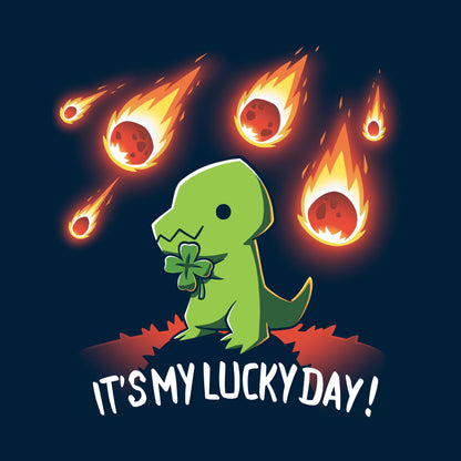 Classic Cotton T-shirt_TeeTurtle It's My Lucky Day navy blue t-shirt featuring a dinosaur holding a four-leaf clover while meteors fall from the sky. The text below reads, "It's my lucky day!"