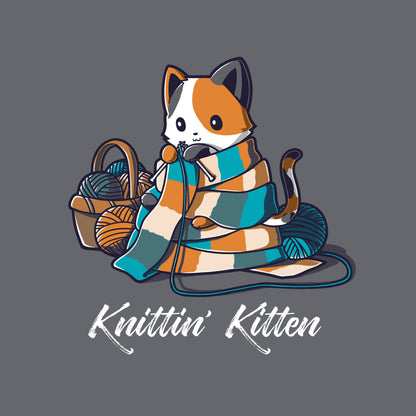 Classic Cotton T-shirt_TeeTurtle Knittin' Kitten charcoal gray t-shirt featuring a calico cat knitting a long scarf that’s wrapped around it with a basket of yarn next to it.