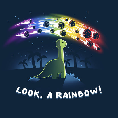 Classic Cotton T-shirt_TeeTurtle Look, a Rainbow! navy blue t-shirt featuring a green dinosaur looking up at rainbow asteroids in the starry night sky. The background is filled with black palm trees in the distance being illuminated from the asteroids, with "LOOK, A RAINBOW!" written underneath the illustration.