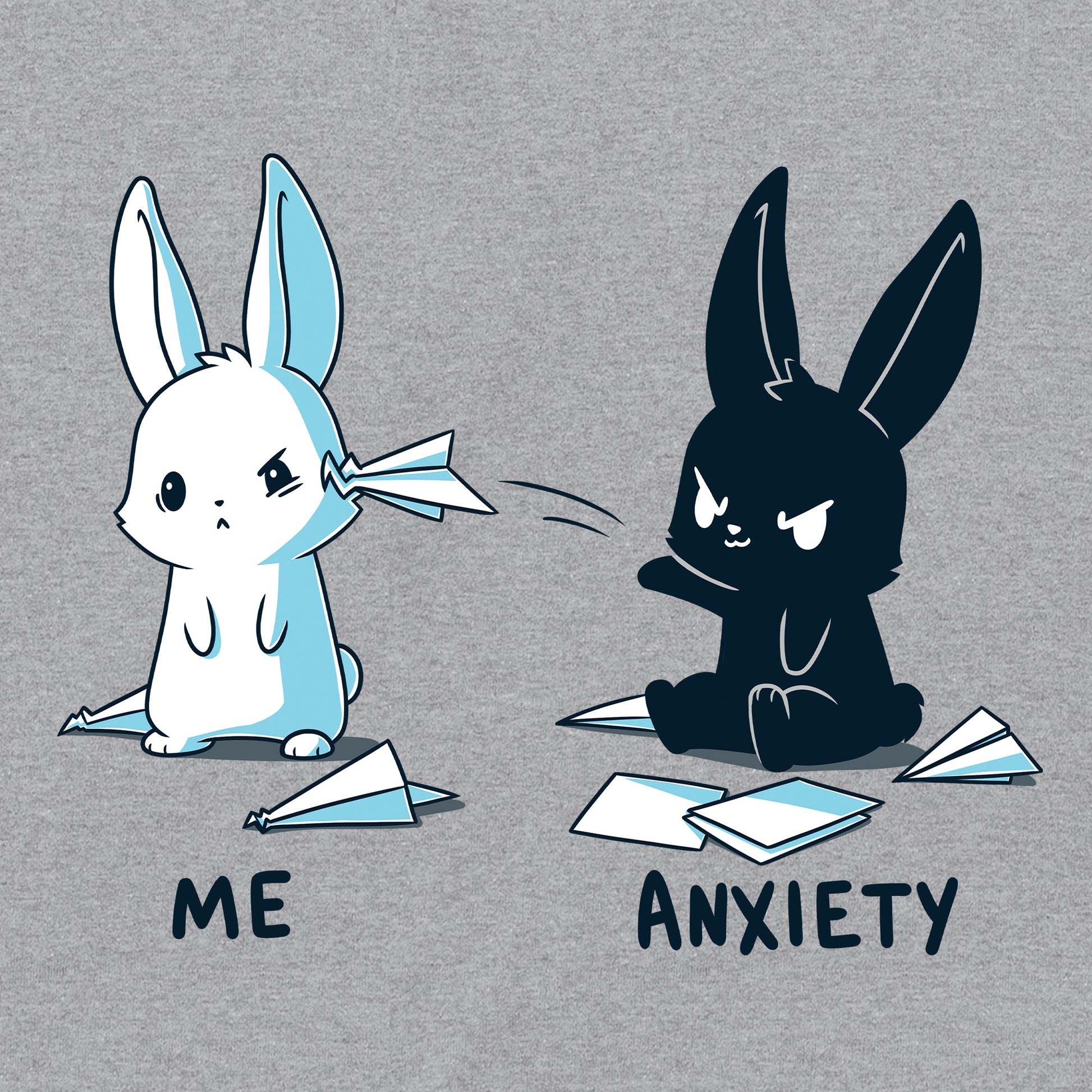 Classic Cotton T-shirt_TeeTurtle Me vs Anxiety heather gray t-shirt featuring an illustration of two cartoon bunnies. A white bunny is labeled "Me," and is looking annoyed while a paper airplane crashes into its face, while a black bunny labeled "Anxiety" aggressively throws paper planes at the other bunny. Paper planes are scattered on the ground around anxiety. 