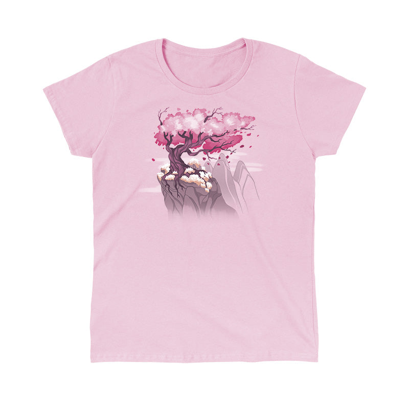 Classic Cotton T-shirt_TeeTurtle Sakura Tree light pink t-shirt featuring an illustration of a pink cherry blossom tree on a rocky cliff with mountains in the background. Blossoms and petals are being blown in the wind. 