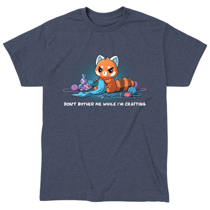 Classic Cotton T-shirt_TeeTurtle heather navy Don't Bother Me While I'm Crafting featuring an introverted, knitting red panda surrounded by knitting materials.