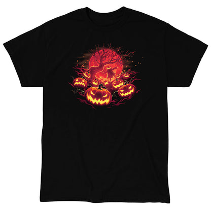 Classic Cotton T-shirt_TeeTurtle Haunted Pumpkin Patch black t-shirt featuring an illustration of glowing, orange-red jack-o-lanterns that show various expressions, such as mischievous grins and sinister scowls that surround a barren skeletal tree that reaches up out from the fiery full moon's edge.  A scarecrow with a jack-o-lantern head stands in the center of the image below the branches amongst the pumpkins.