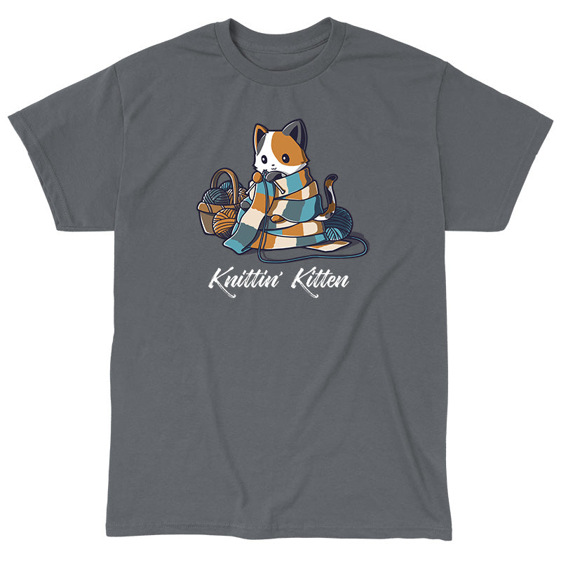 Classic Cotton T-shirt_TeeTurtle Knittin' Kitten charcoal gray t-shirt featuring a calico cat knitting a long scarf that’s wrapped around it with a basket of yarn next to it.