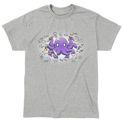 Classic Cotton T-shirt_TeeTurtle Octopus Artist heather gray t-shirt featuring an illustration of a cheerful purple octopus holding various creative tools, surrounded by sketches of sea creatures and nautical elements.