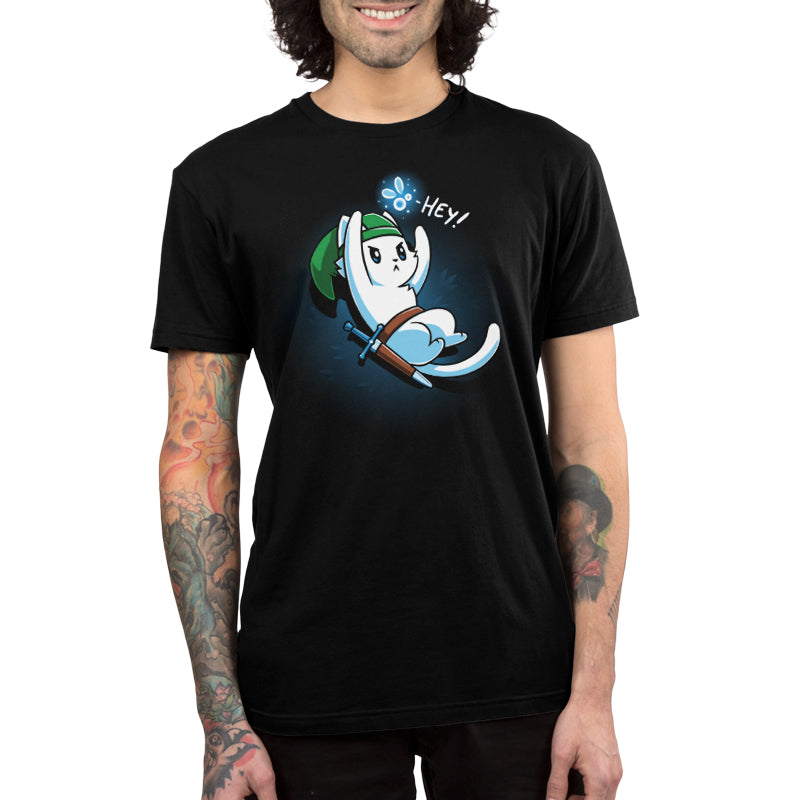  Premium Cotton T-shirt_A cartoon white cat dressed as a warrior with a green hat, holding a sword, looks up on this black monsterdigital apparel. An animated creature above its head says "Hey!" in this super soft ringspun cotton tee.