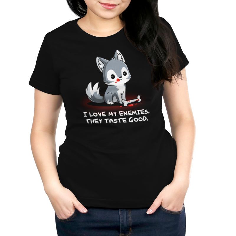 Premium Cotton T-shirt_TeeTurtle I Love My Enemies black t-shirt featuring wolf with blood on its muzzle holding a bone, accompanied by the text "I Love My Enemies. They Taste Good."