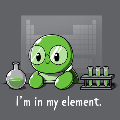 Premium Cotton T-shirt_A cartoon green turtle wearing glasses is in a lab with beakers and test tubes filled with green liquid. Text below reads, "I'm in my element." Wear this scene on an "I'm in My Element" apparel made from charcoal gray Super Soft Ringspun Cotton by monsterdigital.