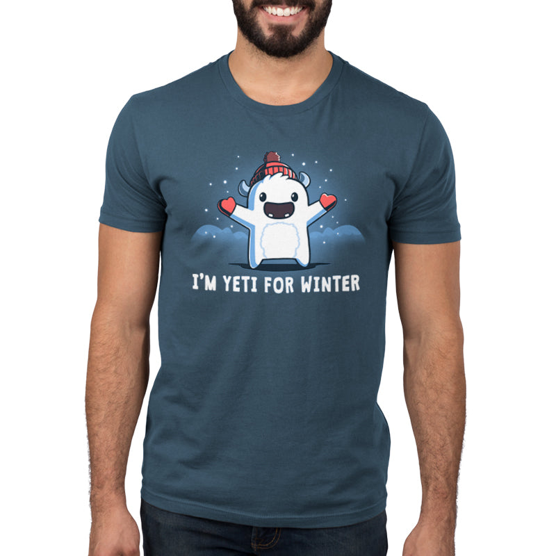 Premium Cotton T-shirt_Teeturtle I'm Yeti for Winter denim t-shirt featuring a happy Yeti in the snowy winter mountains wearing a pom-pom winter hat and mittens.