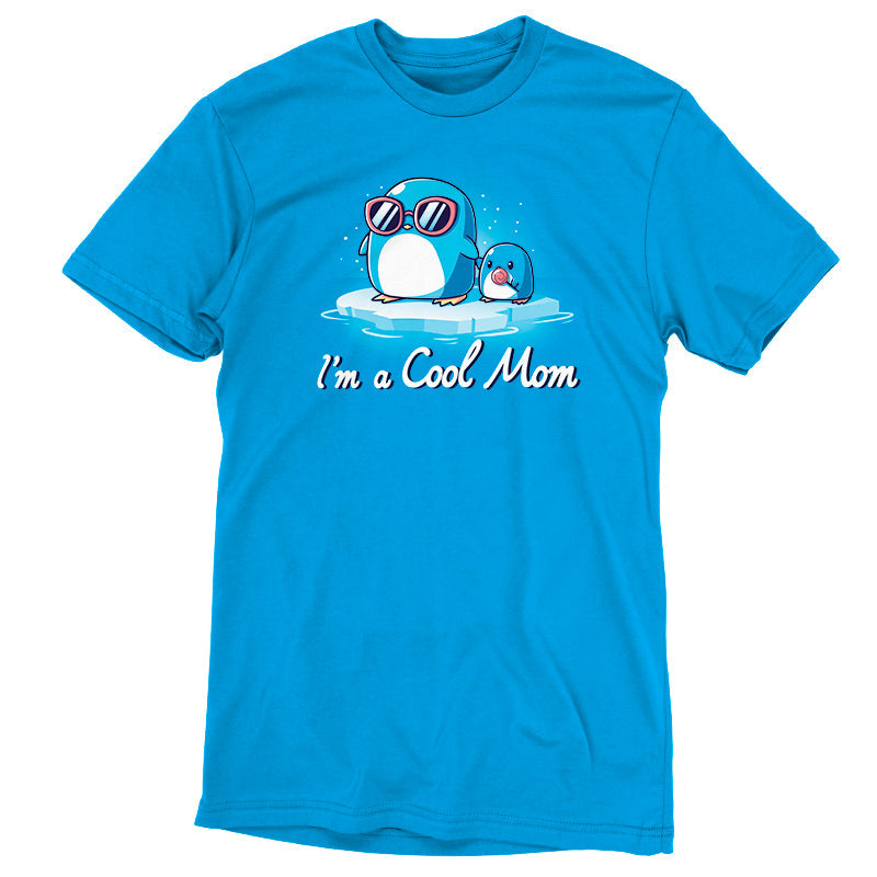 Premium Cotton T-shirt_TeeTurtle I'm a Cool Mom cobalt blue t-shirt featuring two penguins on ice, one wearing sunglasses.