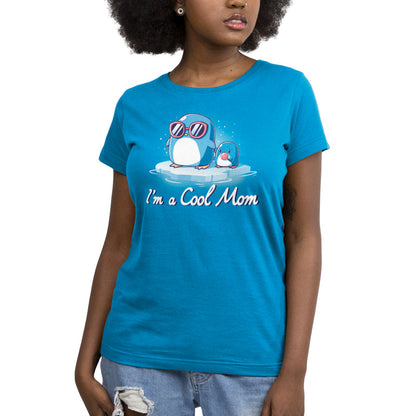 Premium Cotton T-shirt_TeeTurtle I'm a Cool Mom cobalt blue t-shirt featuring two penguins on ice, one wearing sunglasses.