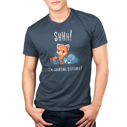 Premium Cotton T-shirt_Teeturtle Shhh! I'm Counting Stitches! denim t-shirt featuring a red panda is knitting with blue yarn. Text above reads, "Shhh! I'm Counting Stitches!" 