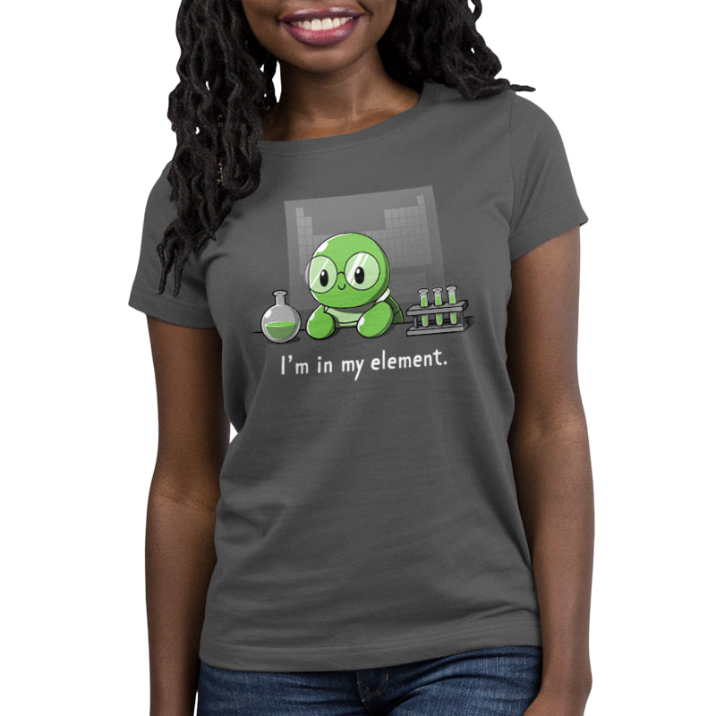 Premium Cotton T-shirt_A cartoon green turtle wearing glasses is in a lab with beakers and test tubes filled with green liquid. Text below reads, "I'm in my element." Wear this scene on an "I'm in My Element" apparel made from charcoal gray Super Soft Ringspun Cotton by monsterdigital.