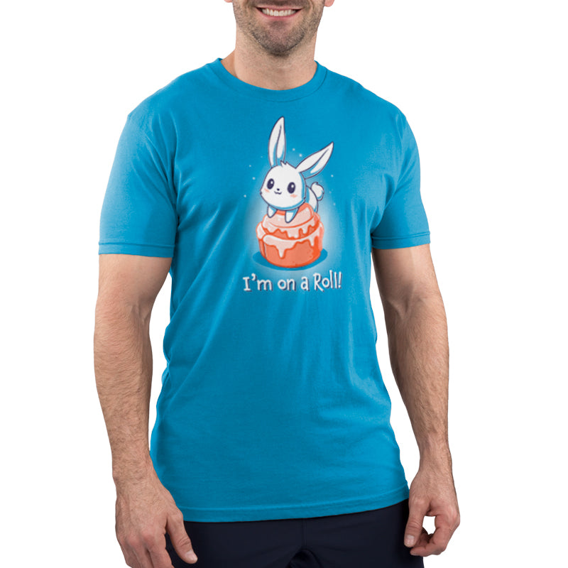 Premium Cotton T-shirt_TeeTurtle I'm On A Cinnamon Roll Cobalt Blue t-shirt featuring a cute cartoon bunny sitting on top of a glazed cinnamon roll with the text "I'm On a Roll!" written below.