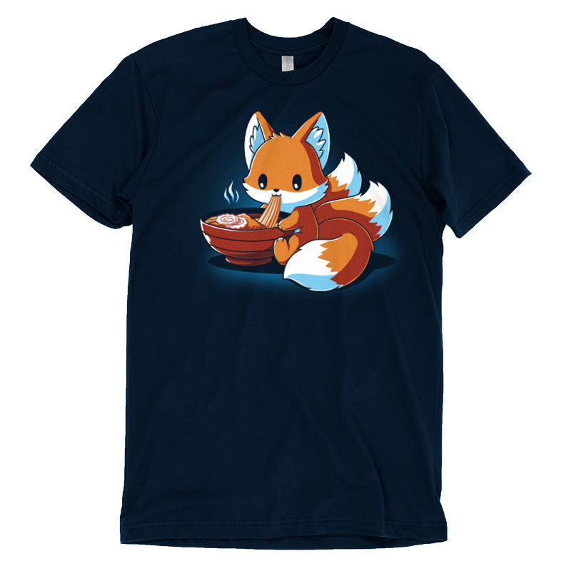 Premium Cotton T-shirt_A cartoon fox, known as the Ramen Kitsune, is sitting and eating noodles from a bowl, holding the noodles with its paws. Steam rises from the bowl. This charming scene is printed on a super soft ringspun cotton navy blue monsterdigital Ramen Kitsune apparel.