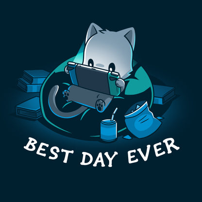 Premium Cotton T-shirt_TeeTurtle Best Day Ever navy blue t-shirt featuring an illustration of a cat sitting on a bean bag chair playing a portal video game surrounded by a mess of books and an open bag of chips and a can of soda with a straw. "BEST DAY EVER" is written underneath.