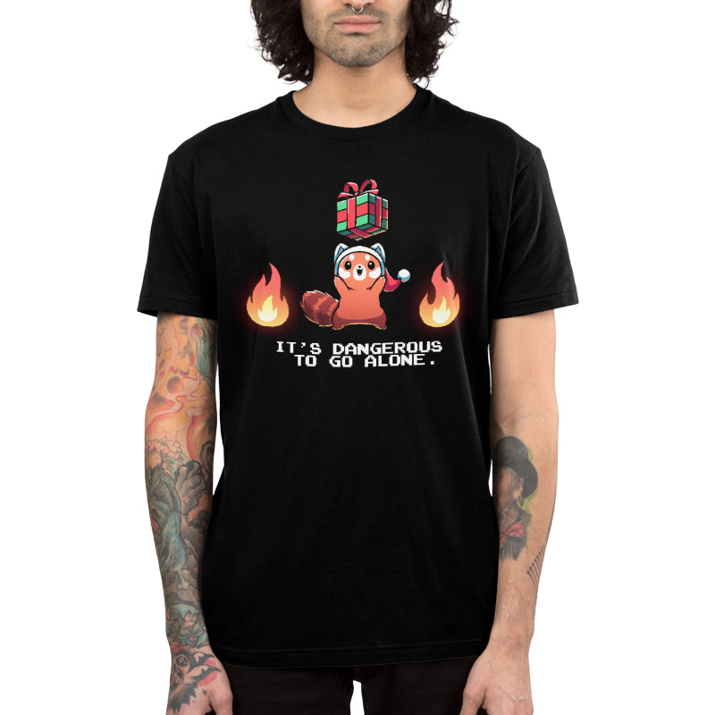 Premium Cotton T-shirt_TeeTurtle black It's Dangerous To Go Alone apparel featuring a red panda holding a floating present surrounded by two flames.