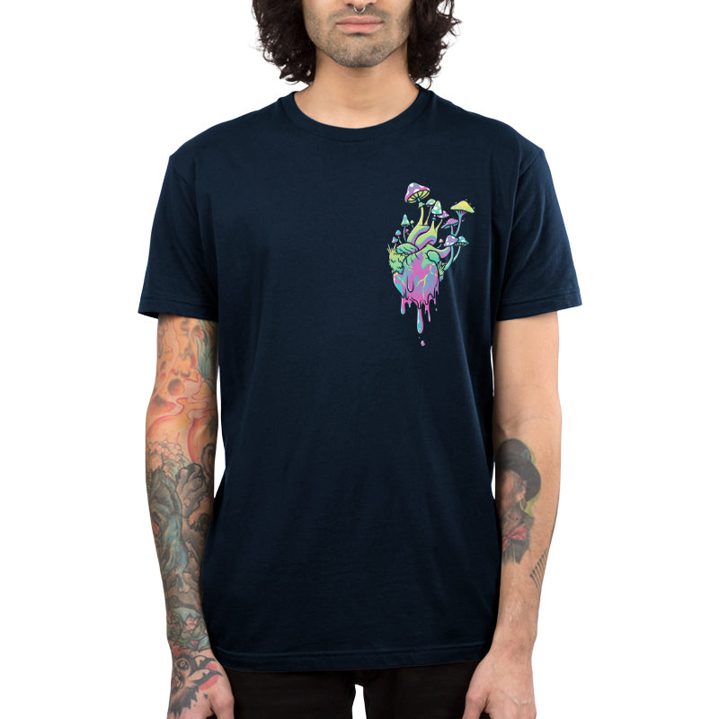 Premium Cotton T-shirt_TeeTurtle Psychedelic at Heart navy blue t-shirt featuring an illustration of a heart colored with pastel shades of pink, green, purple and blue that have a marbling effect, with colorful cartoonish mushrooms and green plants and foliage growing from the dripping heart.