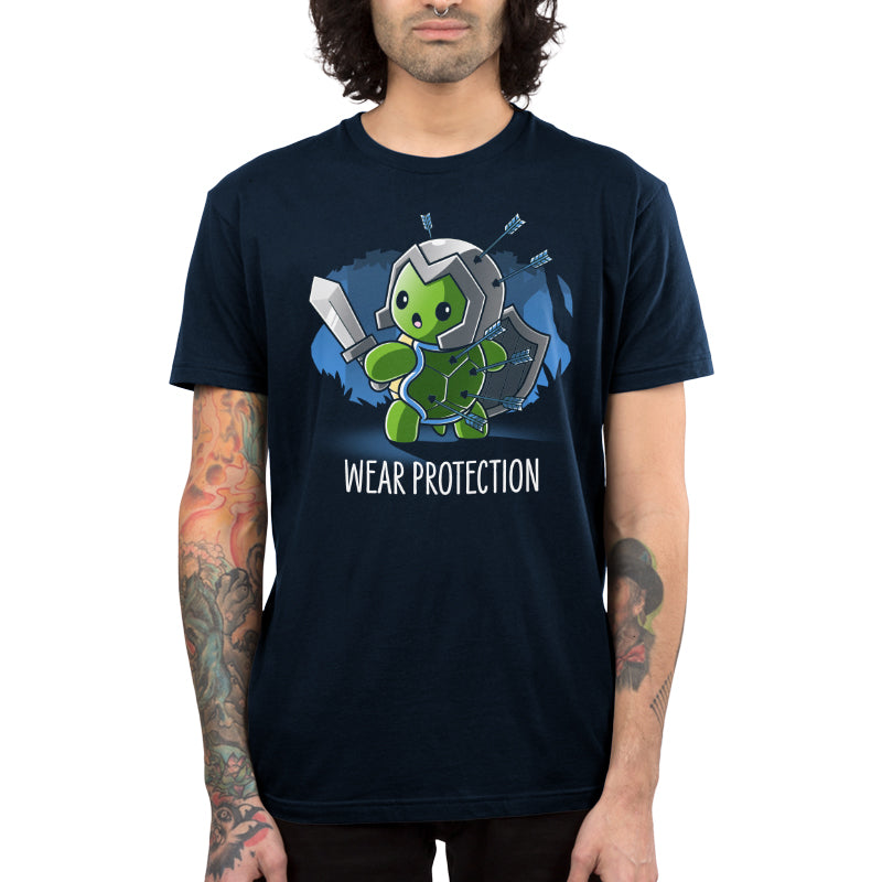 Premium Cotton T-shirt_TeeTurtle Wear Protection navy blue t-shirt featuring a green turtle holding a sword and shield and wearing a helmet looking worried with arrows protruding from it's helmet and shell. "WEAR PROTECTION" is written underneath, and the background is dark navy blue, with stylized, shadowy images of trees in the background.