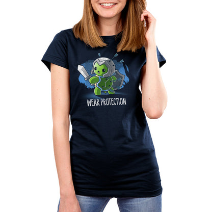 Premium Cotton T-shirt_TeeTurtle Wear Protection navy blue t-shirt featuring a green turtle holding a sword and shield and wearing a helmet looking worried with arrows protruding from it's helmet and shell. "WEAR PROTECTION" is written underneath, and the background is dark navy blue, with stylized, shadowy images of trees in the background.