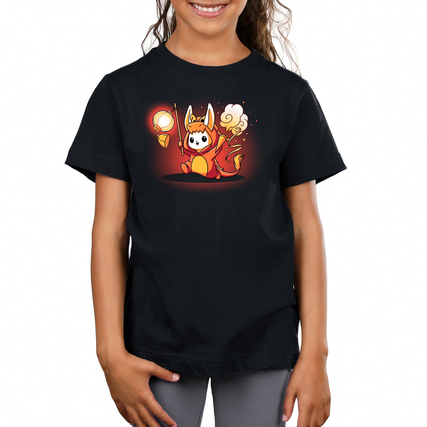 Premium Cotton T-shirt_TeeTurtle Year of the Dragon Kigurumi black t-shirt featuring a white bunny dressed in an orange dragon costume while holding party favors surrounded by orange stars.