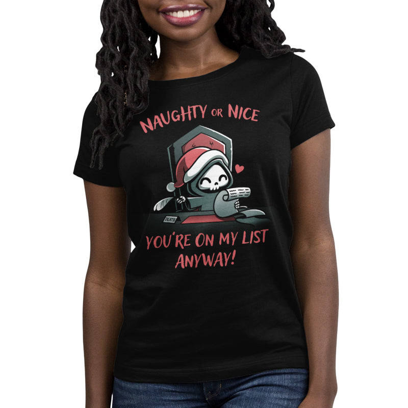 Premium Cotton T-shirt_TeeTurtle Naughty or Nice (Grim Reaper) black t-shirt featuring a smiling grim reaper in a Christmas hat holds a feather quill and a scroll sitting at a desk, with text "NAUGHTY or NICE You're On My List Anyway!".