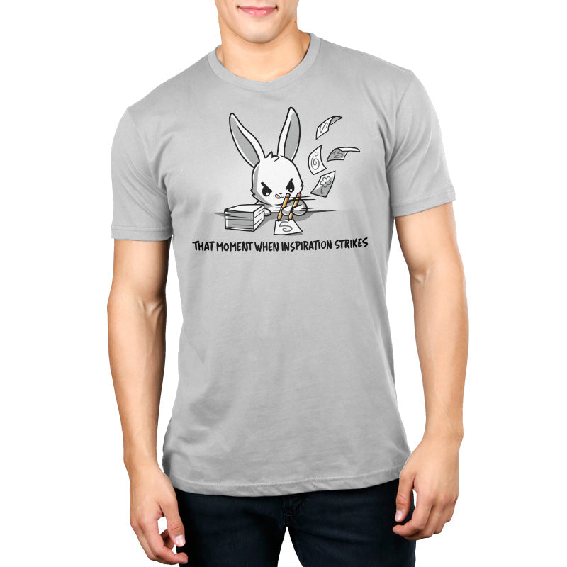 Premium Cotton T-shirt_TeeTurtle When Inspiration Strikes silver gray t-shirt featuring a white bunny rapidly writing on a stack of paper and making the paper fly away from writing so fast. "THAT MOMENT WHEN INSPIRATION STRIKES" is written below.