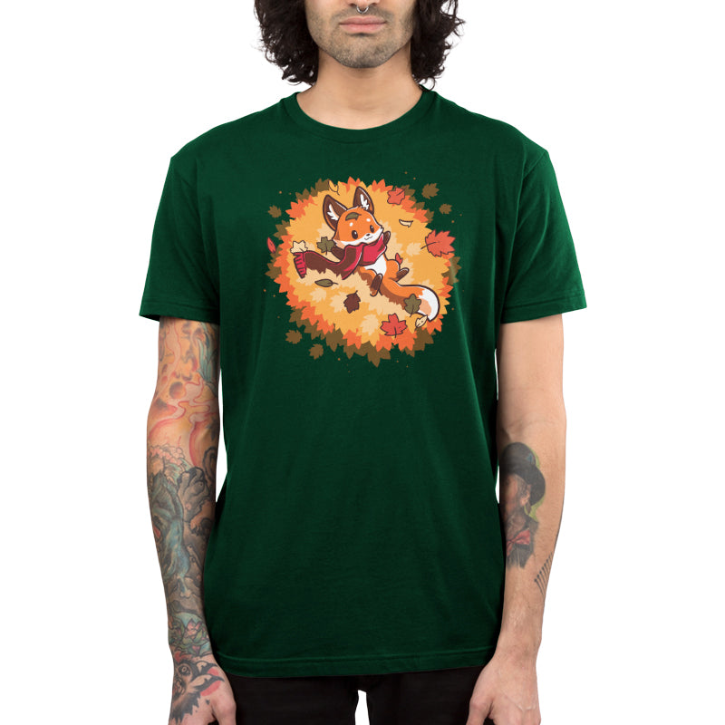 Premium Cotton T-shirt_A cartoon fox wearing a scarf lies on its back surrounded by colorful autumn leaves, showcased on a cozy forest green tee. This Autumn Fox apparel by monsterdigital captures the essence of the season in soft ringspun cotton.